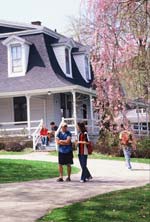 Students walking on fromt of the Umbrella House